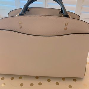 Coach creme, tan and black handbag, with leather strap.